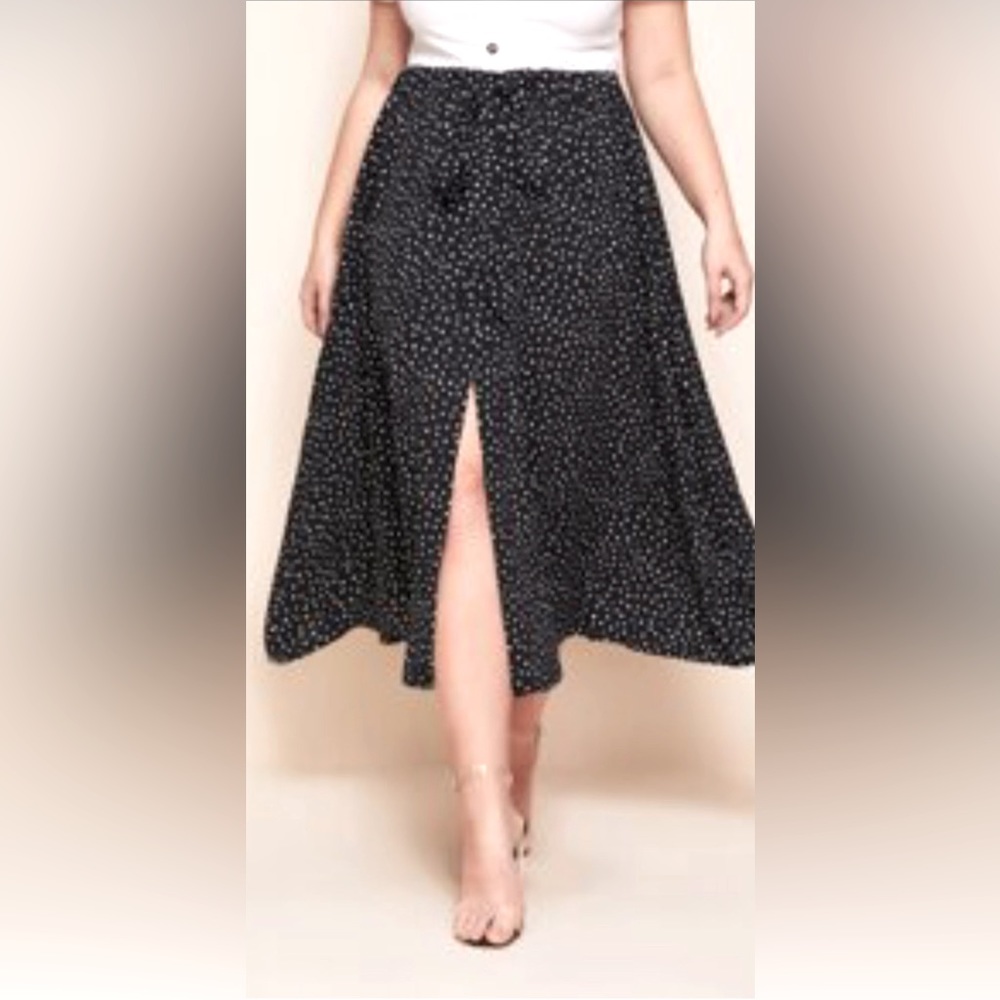 Plus size black skirt with with polka dots.